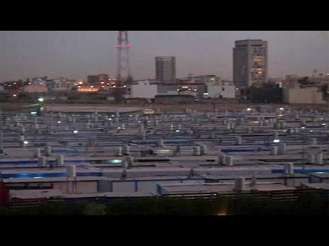 بالفيديو المسيحيون الآشوريون في الموصل ينتقلون إلى مخيمات خاصة بالقرب من أربيل