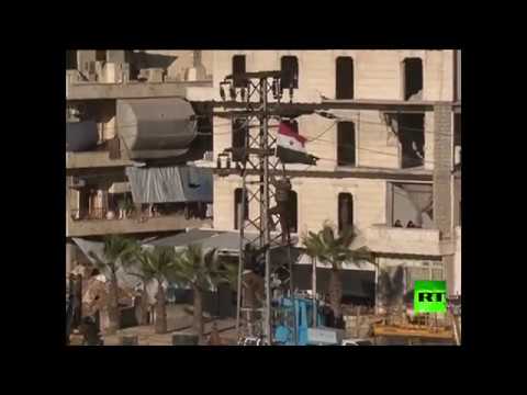 بالفيديو  رفع العلم السوري فوق حلب الشرقية