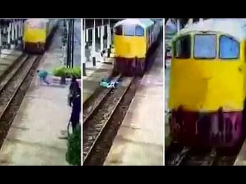 قطار يقطع شاب تايلاندى لكنه يقوم ويجرى بمعجزة