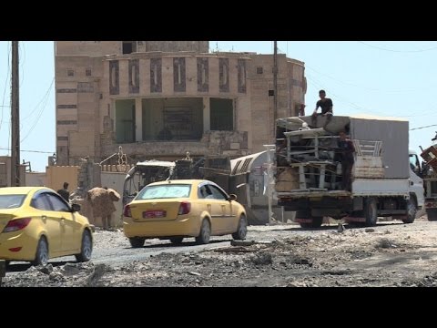 عراقيون يبحثون في الموصل عن سياراتهم