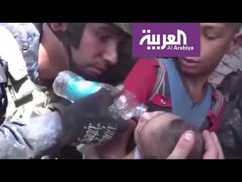 شاهد لحظة إنقاذ مدنيين من تحت أنقاض منازل هدمها داعش
