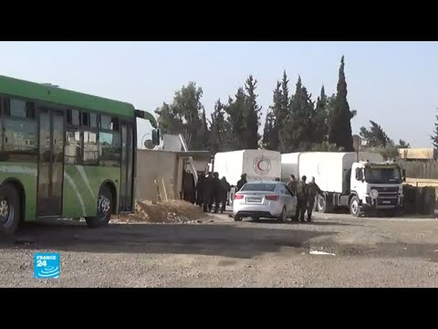 شاهد قافلة المساعدات الإنسانية متوقفة على أبواب الغوطة الشرقية