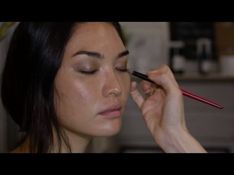 makeup artist applies organic solutions