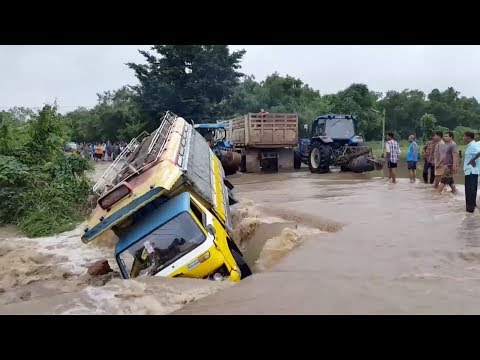 bus washes off road after flash flood
